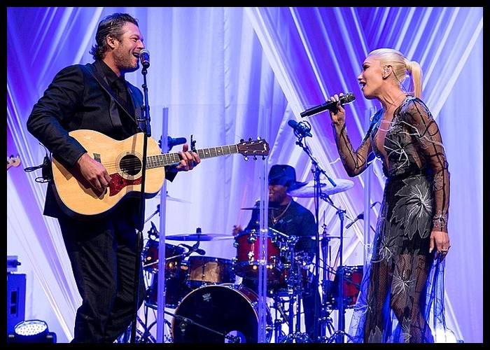 Gwen Stefani Borrows Blake Shelton’s Clothes To ‘Come Back As A Country Boy’