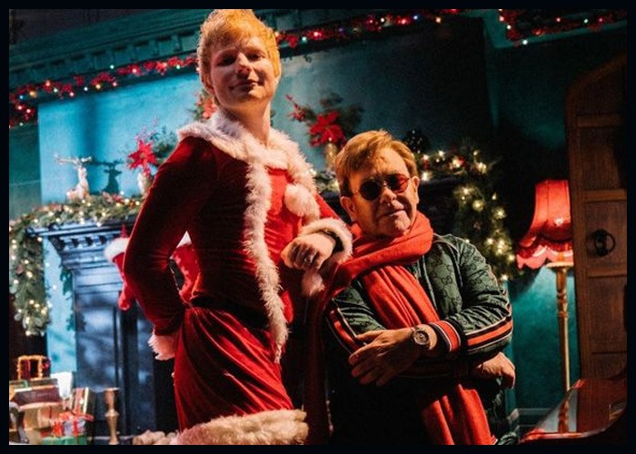 Elton John, Ed Sheeran Re-Create ‘Love Actually’ Scene To Announce New Holiday Song